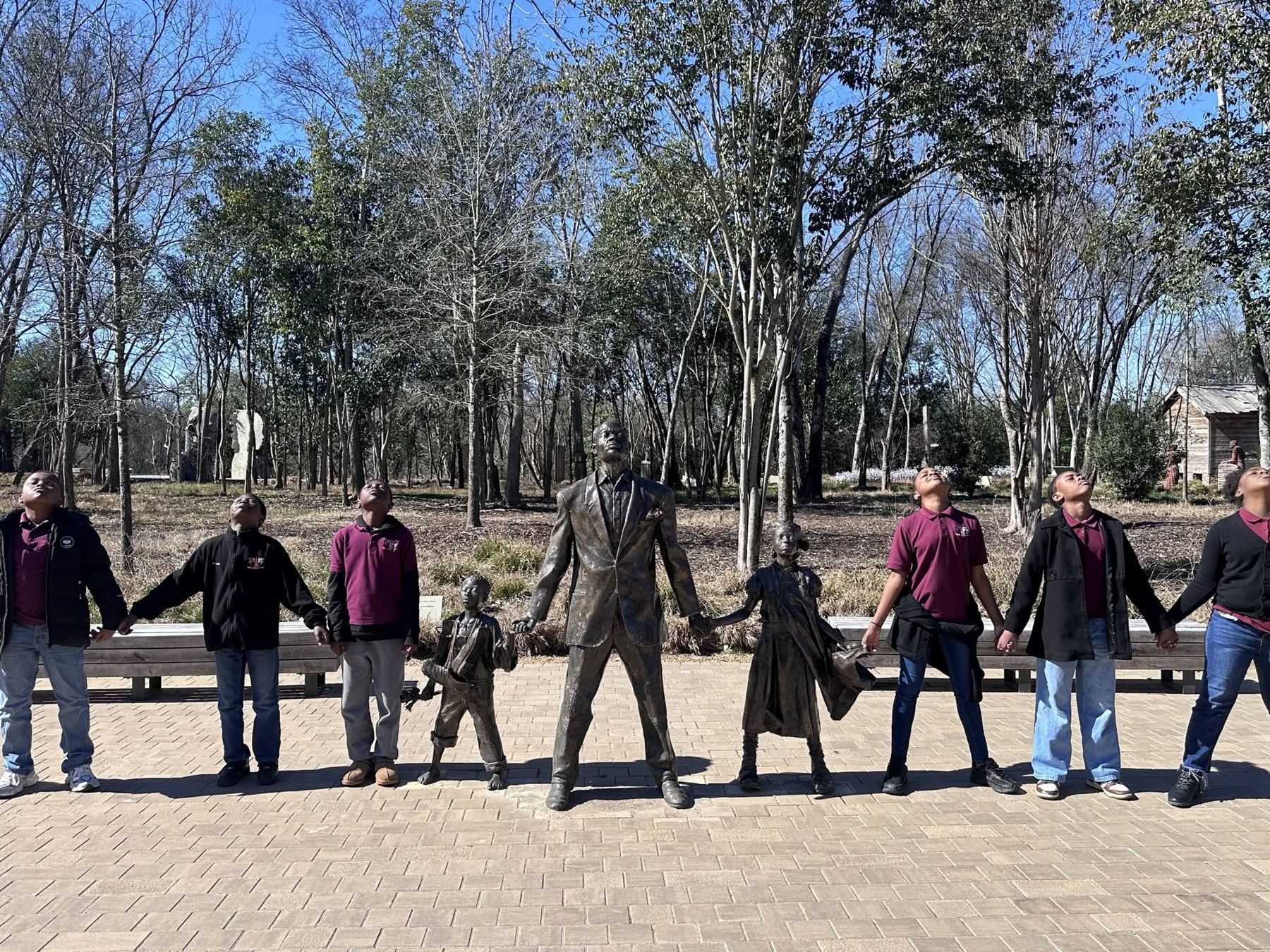 PCA students and staff join hands at the National Memorial for Peace and Justice in Montgomery, Alabama